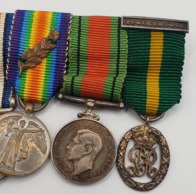WWI and WWII MBE, DCM Gallantry 7 place miniature mounted group.