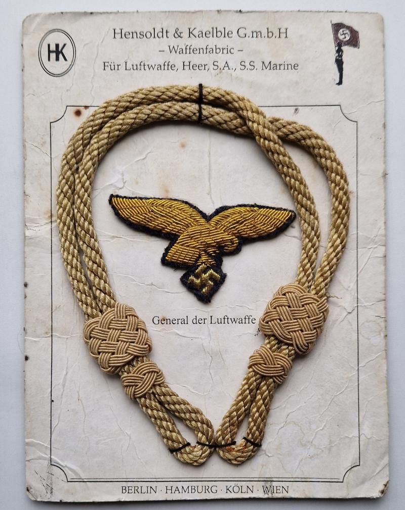 Luftwaffe General bullion cap eagle and visor cap chin cords on original titled manufacturer card by Hensoldt & Kaelble G.m.b.H