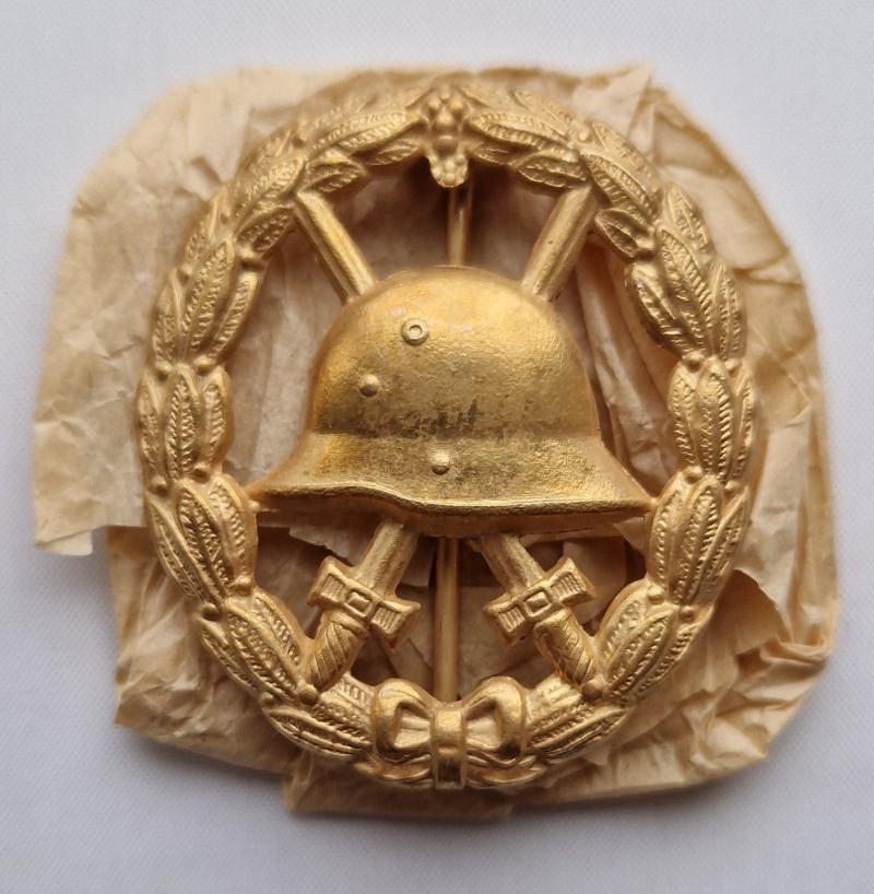 1918 cut-out Gold Wound Badge with original tissue wrap.